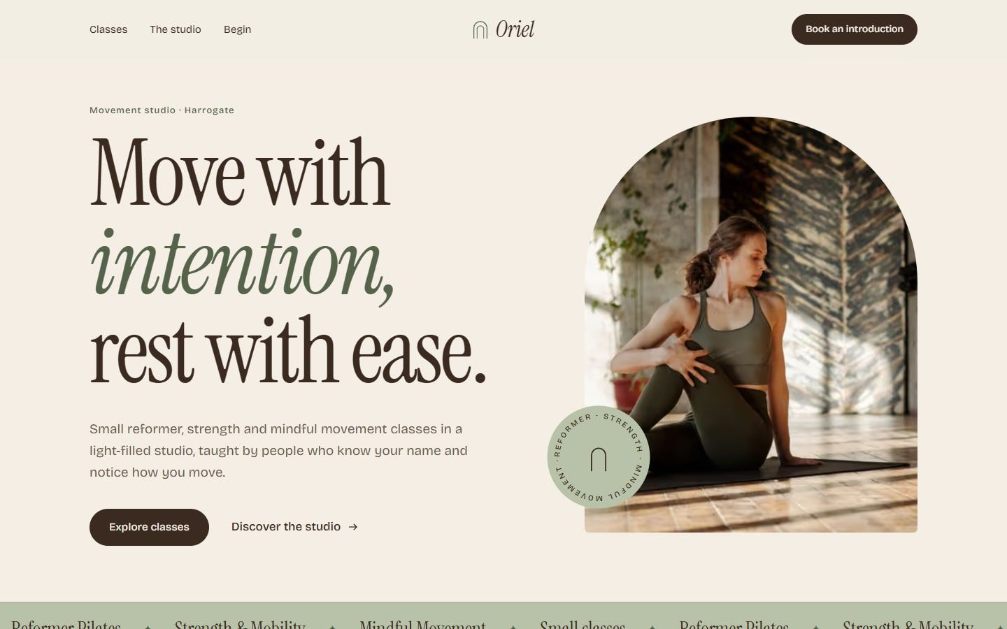 Oriel concept homepage: a cream page with the serif headline "Move with intention, rest with ease." beside an arched photograph of a woman stretching
